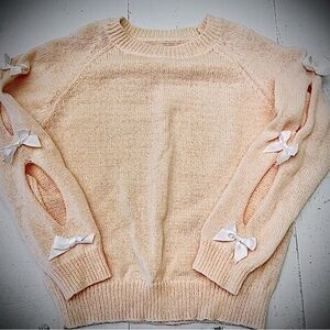 Chic Peach Sweater with Bow Details
